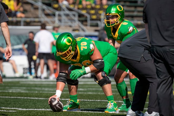 Oregon Ducks offensive lineman Charlie Pickard snaps the ball to Oregon Ducks quarterback Dillon Gabriel during warm ups as the Oregon Ducks host the Idaho Vandals Saturday, Aug. 31, 2024 at Autzen Stadium in Eugene, Ore.