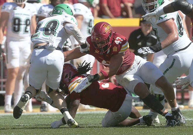 Iowa State Cyclones linebacker Kooper Ebel (47) goes for a take down North Dakota Fighting Hawks running back Gaven Ziebarth (28) during the first quarter in the season opening game at Jack Trice Stadium on Aug. 31, 2024,  in Ames, Iowa