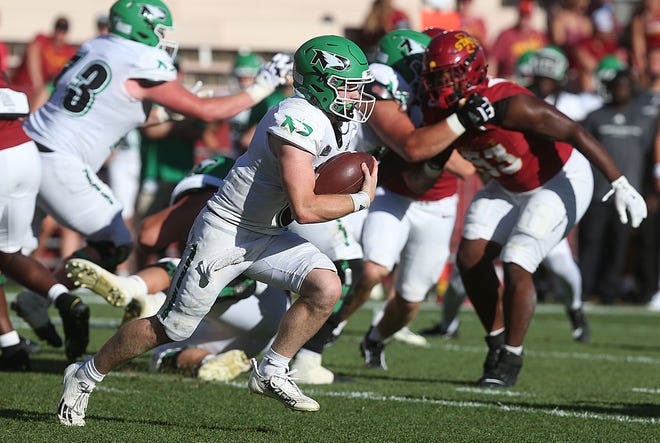 North Dakota Fighting Hawks quarterback Simon Romfo (6) runs with the ball for a first down against Iowa State during the fourth quarter in the season opening game at Jack Trice Stadium on Aug. 31, 2024,  in Ames, Iowa