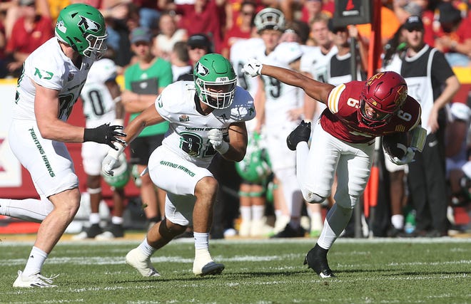 Iowa State Cyclones wide receiver Eli Green (6) tracks a tackle from North Dakota Fighting Hawks defensive line Grady Kentch (92) and linebacker Dylan Boecker (32) during the fourth quarter in the season opening game at Jack Trice Stadium on Aug. 31, 2024,  in Ames, Iowa