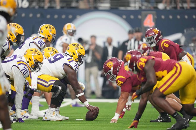 LSU and USC football gather at the line of scrimmage before a play in the first half Sunday, Sept. 1, 2024, at Allegiant Stadium in Paradise, Nev.