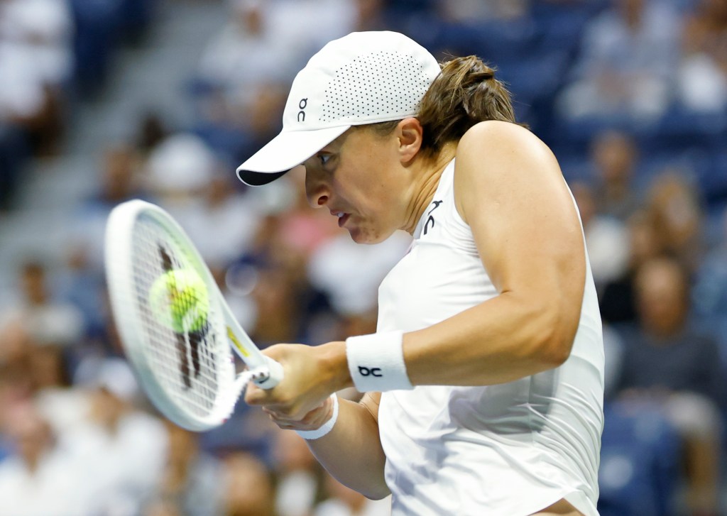 Iga Swiatek of Poland  returns a volley against Liudmila Samsonova of Russia during their match on Arthur Ashe Stadium. 