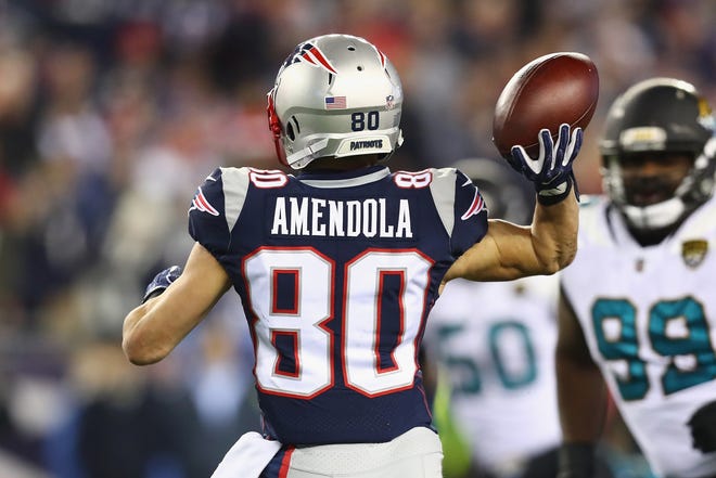 FOXBOROUGH, MA - JANUARY 21: Danny Amendola #80 of the New England Patriots throws the ball during the second half of the AFC Championship Game against the Jacksonville Jaguars at Gillette Stadium on January 21, 2018 in Foxborough, Massachusetts. (Photo by Adam Glanzman/Getty Images)