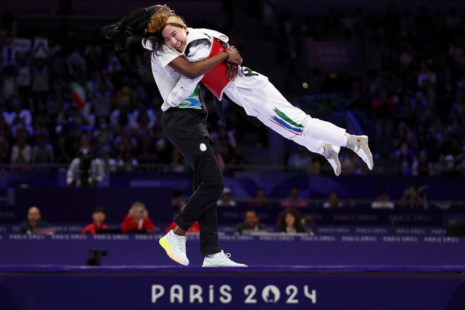 PARIS, FRANCE - AUGUST 29: Bronze Medallist Zakia Khudadadi of Refugee Paralympic Team celebrates after winning the Women's Taekwondo K44 -47kg bronze medal contest against Naoual Laarif of Team Morocco (not pictured) on day one of the Paris 2024 Summer Paralympic Games at Grand Palais on August 29, 2024 in Paris, France.