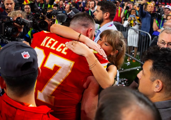 Feb 11, 2024; Paradise, Nevada, USA; Kansas City Chiefs tight end Travis Kelce (87) celebrates with girlfriend Taylor Swift after defeating the San Francisco 49ers in Super Bowl LVIII at Allegiant Stadium.