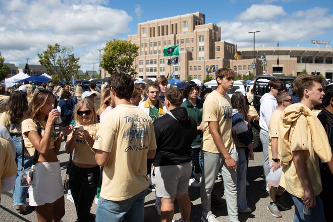 Fans walk through tailgates before a NCAA college football game between Notre Dame and Northern Illinois at Notre Dame Stadium on Saturday, Sept. 7, 2024, in South Bend.