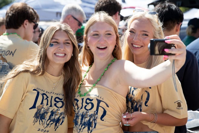 From left to right, Saint Mary's students Parker Harrington, Annie Sutherland and Meghan McManus poses for a selfie at a tailgate before a NCAA college football game between Notre Dame and Northern Illinois at Notre Dame Stadium on Saturday, Sept. 7, 2024, in South Bend.