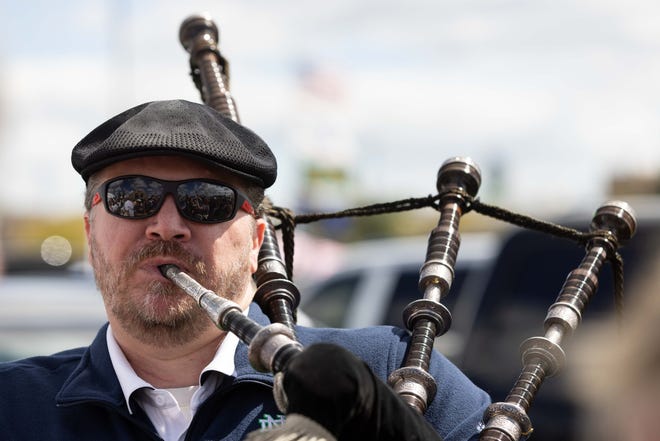 Dave Younger plays the bagpipes at a tailgate before a NCAA college football game between Notre Dame and Northern Illinois at Notre Dame Stadium on Saturday, Sept. 7, 2024, in South Bend.