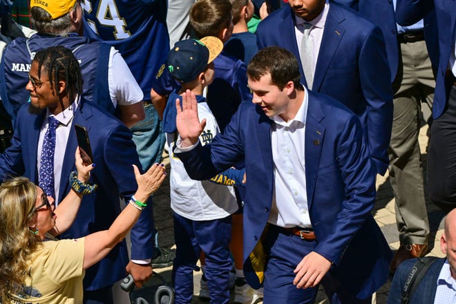 Sep 7, 2024; South Bend, Indiana, USA; Notre Dame Fighting Irish quarterback Riley Leonard greets fans as the team arrives for the game against the Northern Illinois Huskies at Notre Dame Stadium. Mandatory Credit: Matt Cashore-Imagn Images