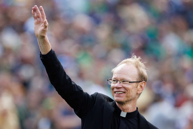 University of Notre Dame President Rev. Robert A. Dowd waves to the crowd before a NCAA college football game between Notre Dame and Northern Illinois at Notre Dame Stadium on Saturday, Sept. 7, 2024, in South Bend.