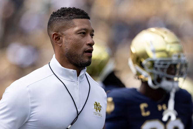 Notre Dame head coach Marcus Freeman jogs the field during warm ups before a NCAA college football game between Notre Dame and Northern Illinois at Notre Dame Stadium on Saturday, Sept. 7, 2024, in South Bend.