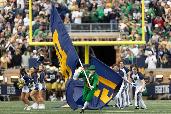 Notre Dame runs onto the field before a NCAA college football game between Notre Dame and Northern Illinois at Notre Dame Stadium on Saturday, Sept. 7, 2024, in South Bend.