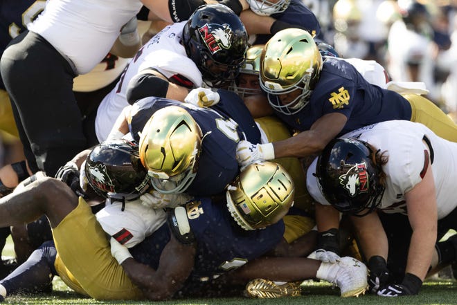 Notre Dame and Northern Illinois get in a dog pile during a NCAA college football game between Notre Dame and Northern Illinois at Notre Dame Stadium on Saturday, Sept. 7, 2024, in South Bend.