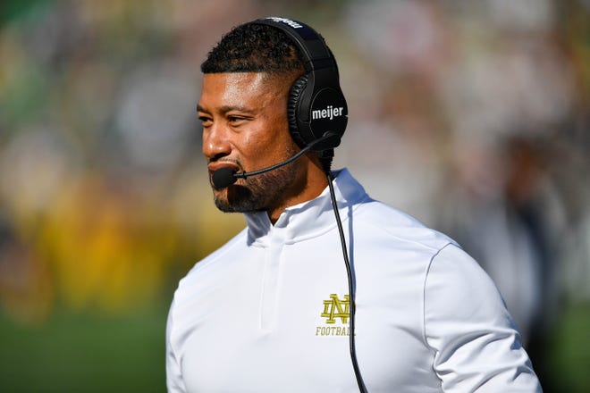 Sep 7, 2024; South Bend, Indiana, USA; Notre Dame Fighting Irish head coach Marcus Freeman walks to the sideline in the second quarter against the Northern Illinois Huskies at Notre Dame Stadium. Mandatory Credit: Matt Cashore-Imagn Images