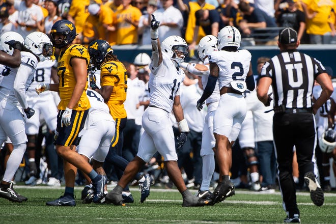 Penn State's Abdul Carter (11) motions after the defense recovered a West Virginia fumble in the first half of an NCAA football game, Saturday, August 31, 2024, in Morgantown, W. Va.