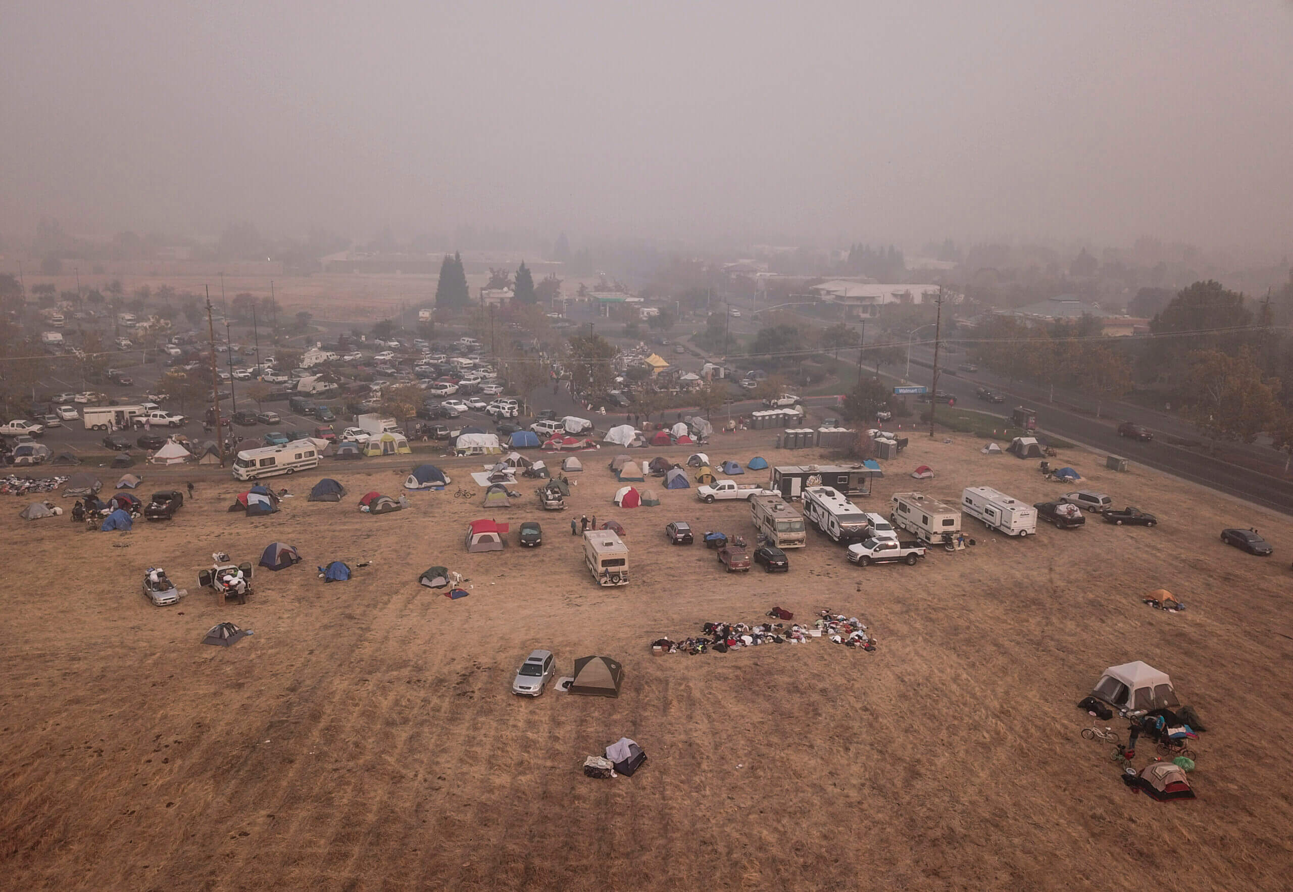 Evacuees from the Camp Fire shelter in tents outside the Walmart on November 16, 2018 in Chico, Ca. Most of Paradise, California has been destroyed by the Camp Fire as the largest search and rescue effort in California is taking place with over 600 people still missing.