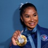 Jordan Chiles of the United States, poses with her bronze medal following the women's gymnastics floor exercise event final on Monday at the Paris Olympics. The International Olympic Committee says Chiles must return the medal following an arbitrator's decision that her initial scoring appeal came in four seconds too late.