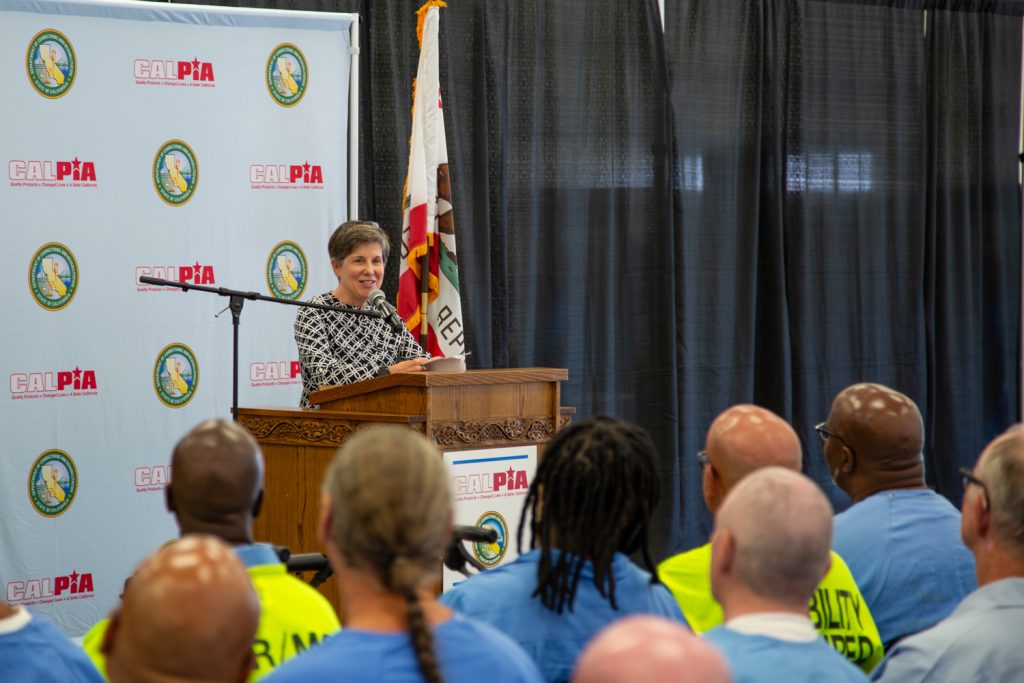 A CDCR undersecretary speaks at the graduation.