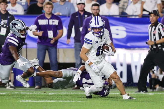 BYU's Parker Kingston (11) returns a punt 90 yards for a touchdown in the third quarter Saturday night against Kansas State at LaVell Edwards Stadium in Provo, Utah.