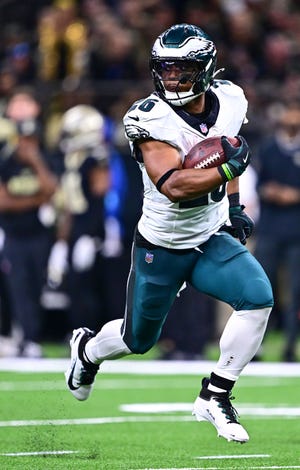 Saquon Barkley #26 of the Philadelphia Eagles runs for a touchdown against the New Orleans Saints during the fourth quarter at Caesars Superdome on September 22, 2024 in New Orleans, Louisiana.