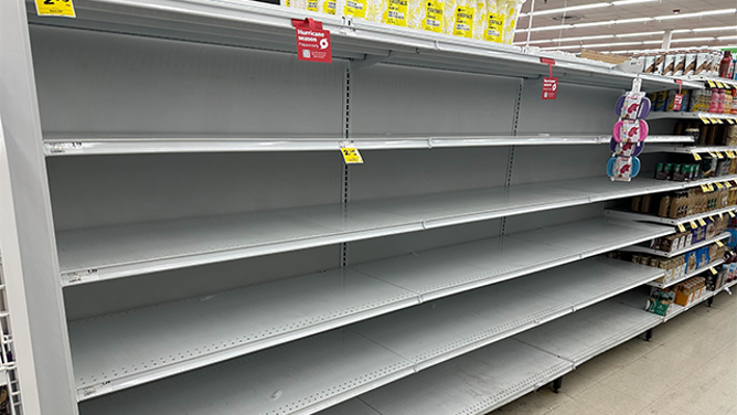 This image shows empty shelves at a Winn-Dixie in St. Petersburg, Florida, ahead of Helene.