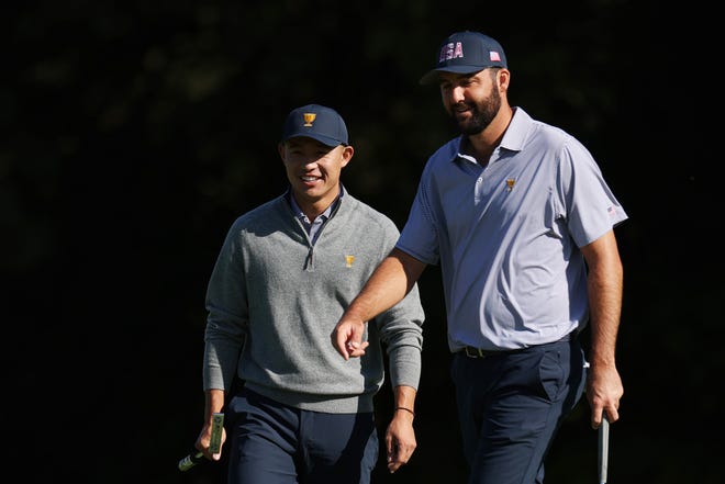 U.S. team members Scottie Scheffler and Collin Morikawa talk during a practice round before the 2024 Presidents Cup at The Royal Montreal Golf Club.