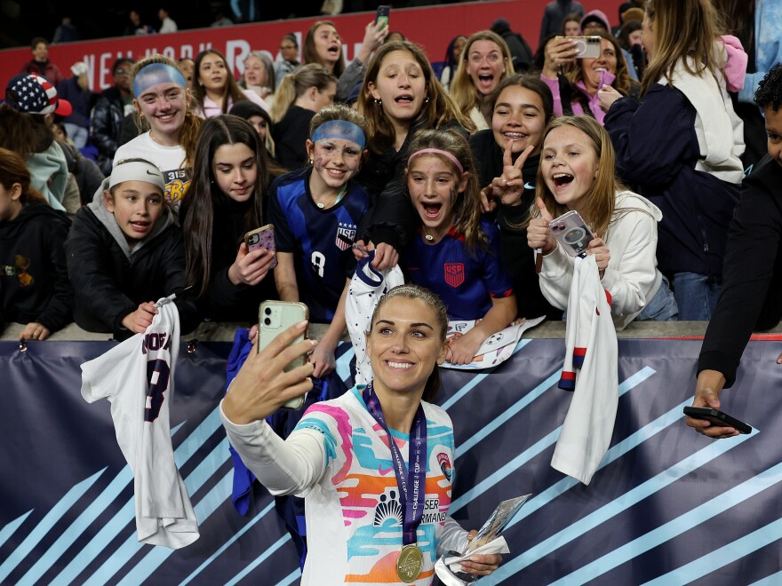 Alex Morgan of the San Diego Wave takes a selfie with fans after the 2024 NWSL Challenge Cup match on March 15, 2024 in Harrison, N.J.