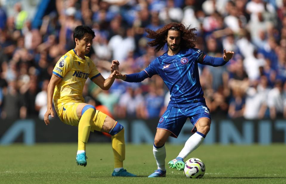 Marc Cucurella holds off Daichi Kamada (Chelsea FC via Getty Images)