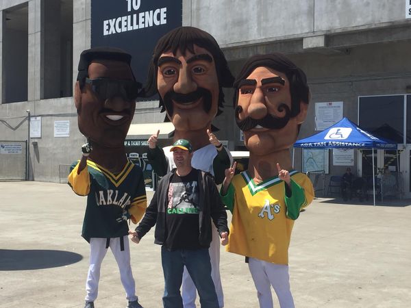 The author poses with famous A's mascot players Rickey Henderson, Dennis Eckersley and Rollie Fingers. (Thomas Gase - Times-Herald)