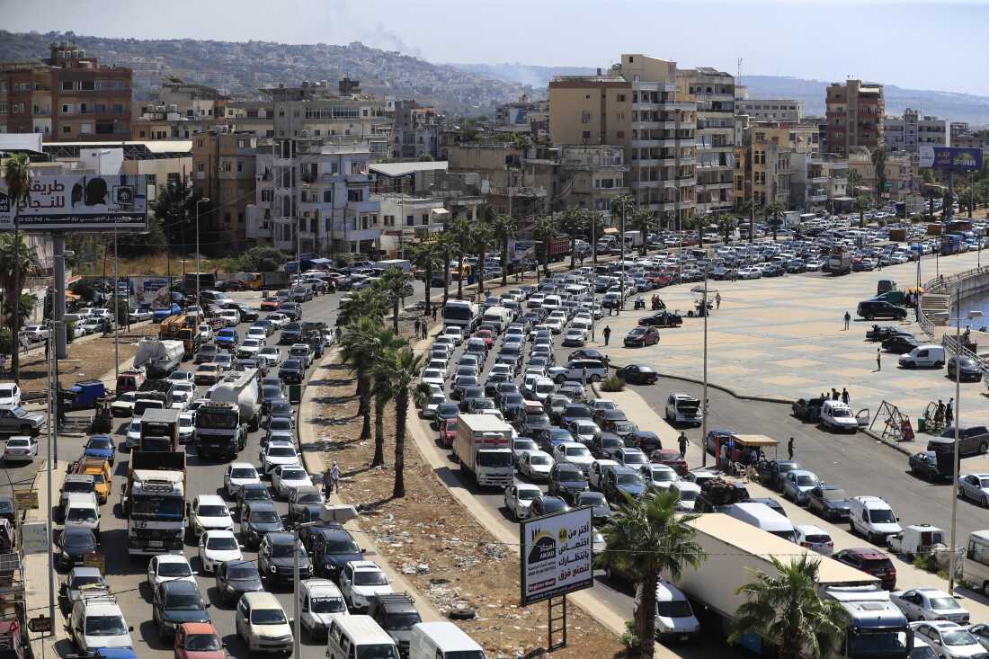 Cars sit in traffic as they flee the southern villages amid ongoing Israeli airstrikes, in Sidon, Lebanon, Monday.