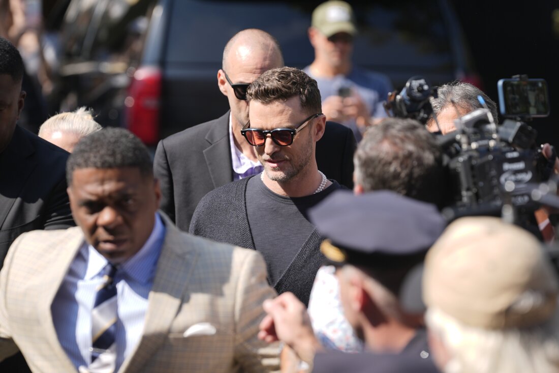 Justin Timberlake (center) walks into court for a hearing Friday in Sag Harbor, N.Y.