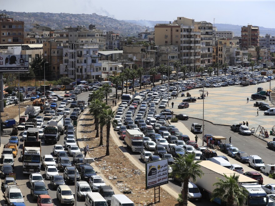 Cars sit in traffic as they flee the southern villages amid ongoing Israeli airstrikes, in Sidon, Lebanon, Monday.