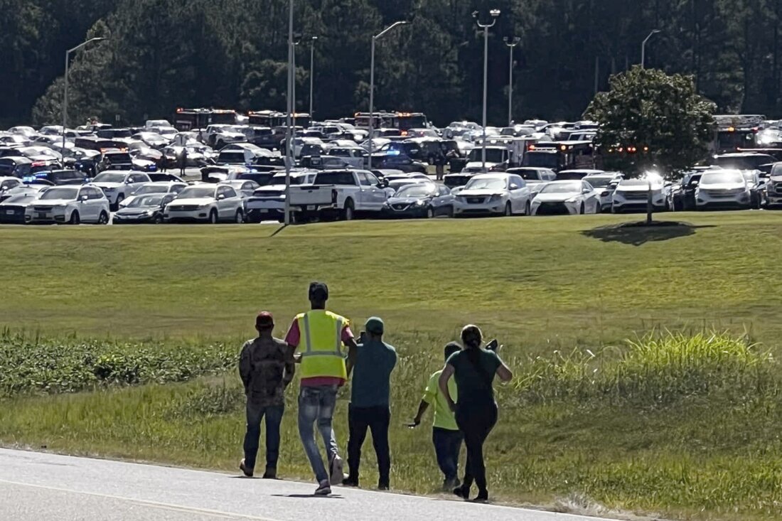 Students are evacuated to the football stadium after the school campus was placed on lockdown at Apalachee High School in Winder, Ga., on Wednesday.