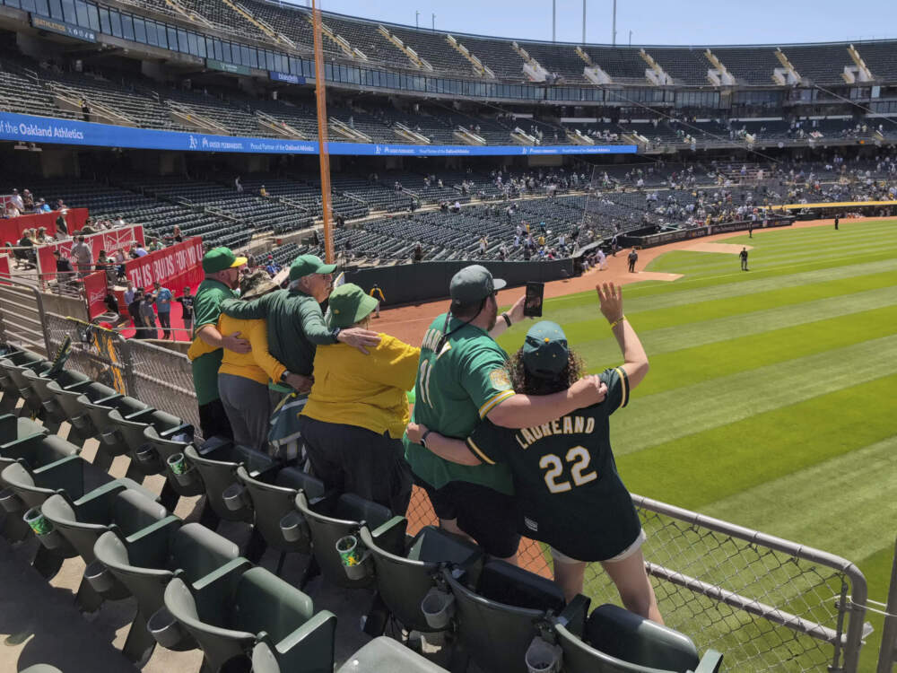 'Right-Field' Will MacNeil and several other A's fans sing 'Take Me Out To The Ballgame' in the Oakland Coliseum during the seventh-inning stretch of a game against the Pittsburgh Pirates on May 1, 2024, in Oakland, Calif. (Michael Liedtke/AP)