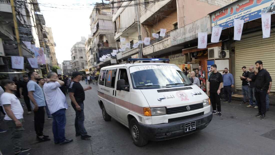 An ambulance believed to be carrying wounded people, after multiple explosions were heard during the funeral of four Hezbollah fighters who were killed Tuesday after their handheld pagers exploded, in a southern suburb of Beirut, Lebanon, Wednesday.