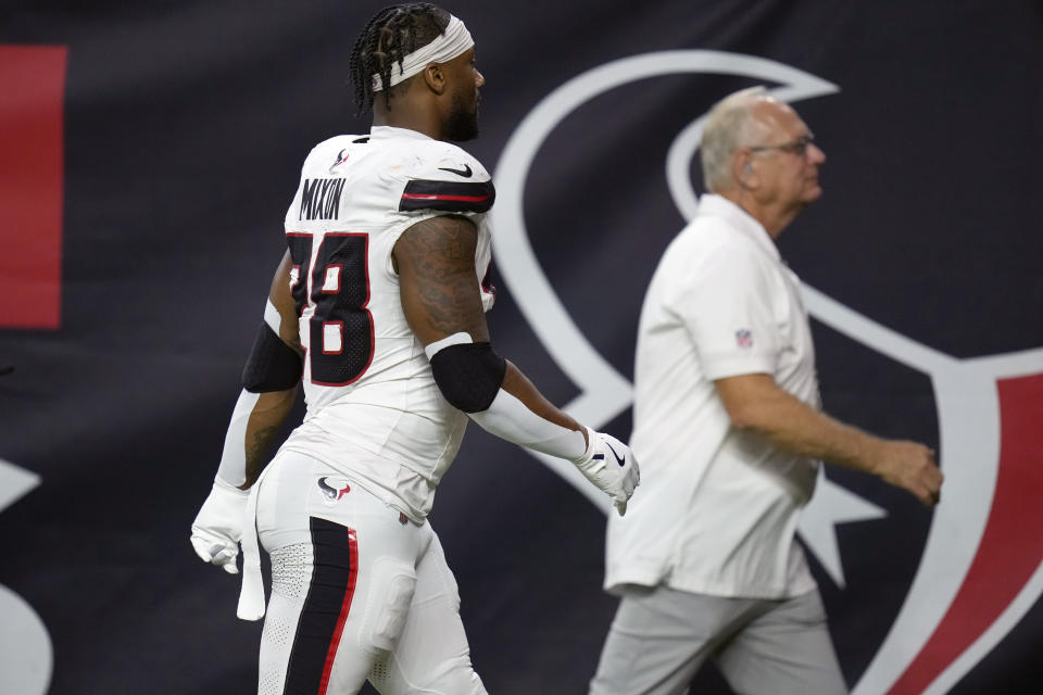 Houston Texans running back Joe Mixon heads off the field after being injured. (AP Photo/Eric Christian Smith)