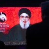 Supporters listen to Hezbollah leader Hassan Nasrallah via a video link during a ceremony to mark the first week since the killing of Hezbollah's top commander Fuad Shukr on August 6 in Beirut. The militant group on Saturday confirmed Nasrallah had been killed following Israeli airstrikes.