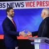 Minnesota Gov. Tim Walz and Ohio Sen. JD Vance shake hands after the vice presidential debate at the CBS Broadcast Center on Tuesday in New York City.