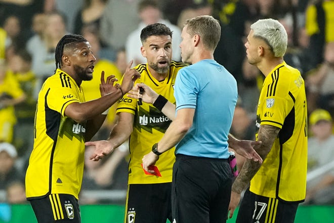 Oct 2, 2024; Columbus, OH, USA; Columbus Crew defender Rudy Camacho (4) reacts to receiving a red card with defender Steven Moreira (31) and forward Christian Ramirez (17) during the second half of the MLS soccer game at Lower.com Field. Miami won 3-2.