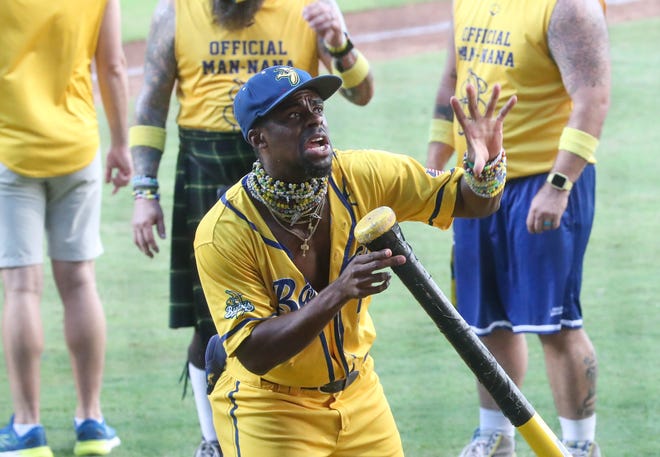 Flash Tha Kid uses a giant bat as a microphone on Saturday, September 28, 2024 during the Savannah Bananas' final home series of the season at Historic Grayson Stadium.