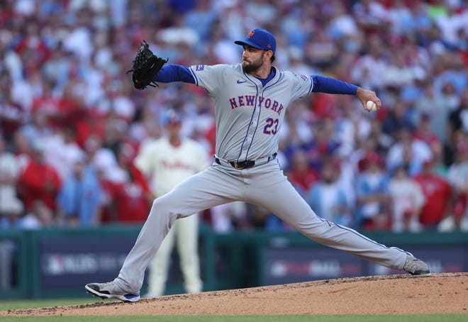 Oct 5, 2024; Philadelphia, PA, USA; New York Mets pitcher David Peterson (23) throws a pitch against the Philadelphia Phillies in the third inning in game one of the NLDS for the 2024 MLB Playoffs at Citizens Bank Park. Mandatory Credit: Bill Streicher-Imagn Images