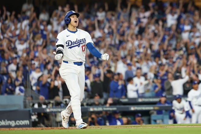 Shohei Ohtani watches his home run in Game 1.