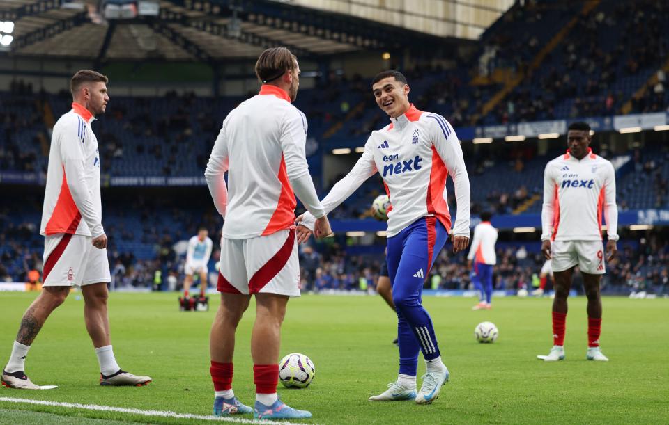 Forest players warm up at Stamford Bridge before kick-off (Reuters)