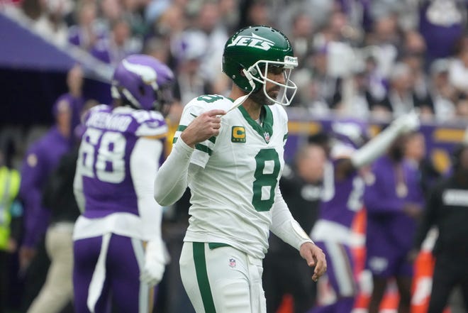 Oct 6, 2024; London, United Kingdom; New York Jets quarterback Aaron Rodgers (8) reacts after throwing an interception against the Minnesota Vikings in the first half at Tottenham Hotspur Stadium. Mandatory Credit: Kirby Lee-Imagn Images