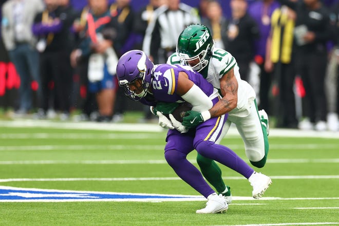 Oct 6, 2024; Tottenham, ENG; Minnesota Vikings Defensive Back Camryn Bynum (24) intercepts a pass in the 1st Quarter against New York Jets at Tottenham Hotspur Stadium. Mandatory Credit: Shaun Brooks-Imagn Images