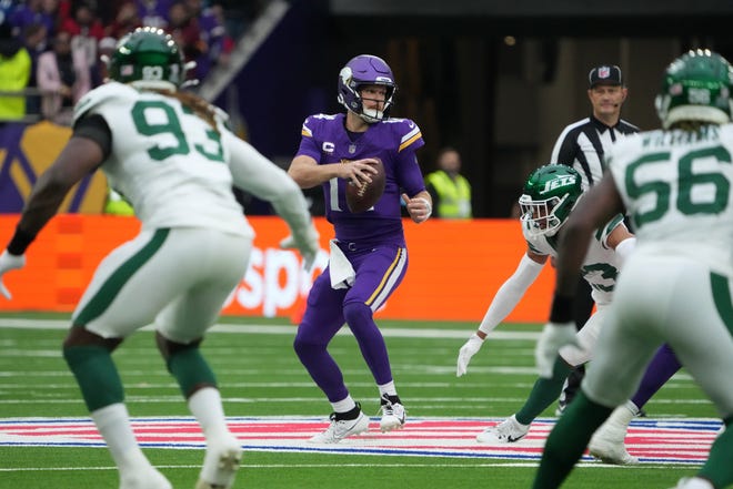 Oct 6, 2024; London, United Kingdom; Minnesota Vikings quarterback Sam Darnold (14) throws the ball against the New York Jets in the first half at Tottenham Hotspur Stadium. Mandatory Credit: Kirby Lee-Imagn Images