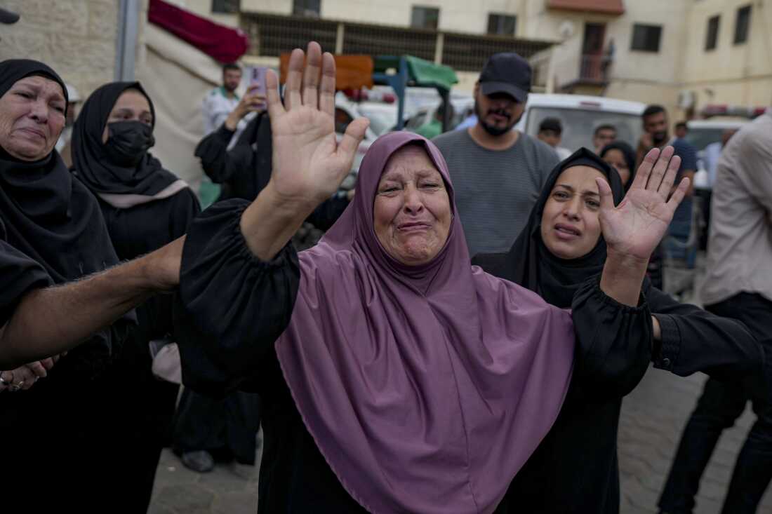 Palestinians mourn relatives killed in the Israeli bombardment of the Gaza Strip, at a hospital in the Gaza town of Deir al-Balah, on Oct. 1, 2024.