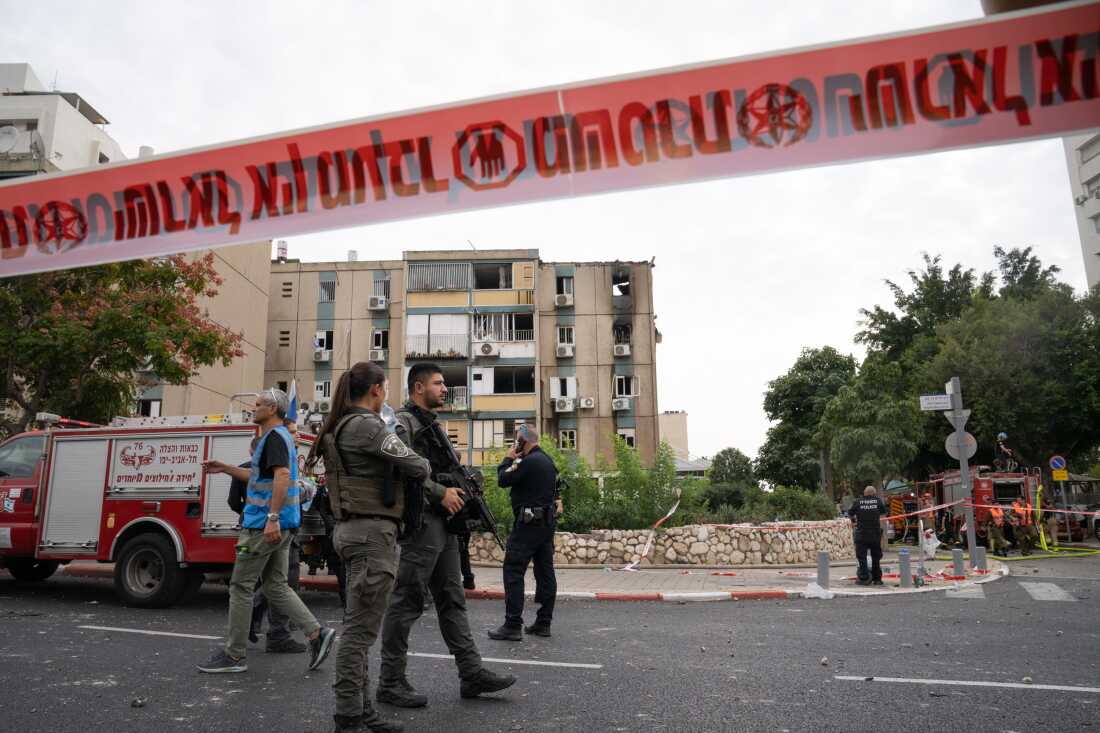 First responders at the site of a rocket strike that hit a residential building in Tel Aviv, Israel, on Oct. 27, 2023.