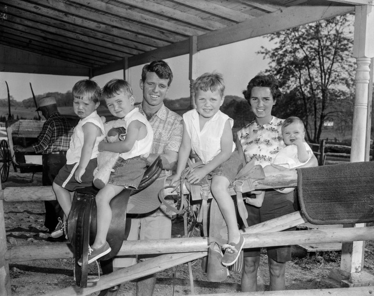 Robert Kennedy and His Wife with Four of Their Children stand outside. The children, from left, are: David Anthony, Robert Francis, Joseph Pat, and Mary Courtney.