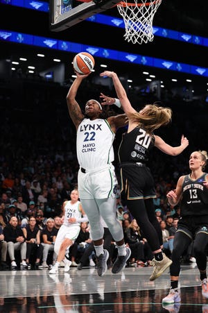 Myisha Hines-Allen shoots over Sabrina Ionescu during the first half.